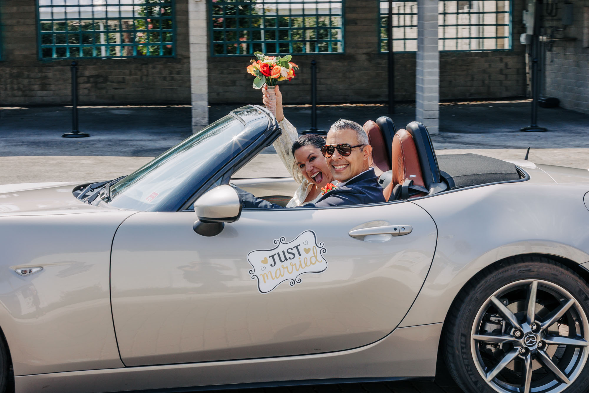 bride and groom getaway car
